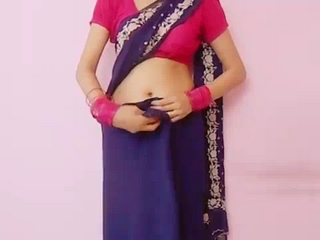 Vid gal 260 Young indian girl teaching how to wear a saree. 
