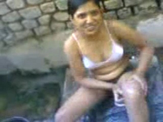 Vid gal 303. Indian girl in open air shower near amritsar